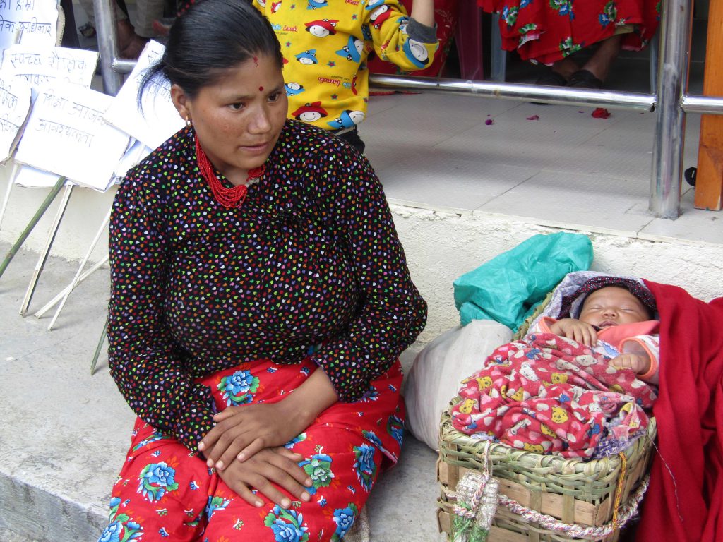 New mother at International Literacy Day event, Sept. 2018